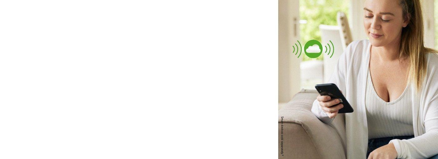 A woman using her mobile phone to share and follow her glucose data